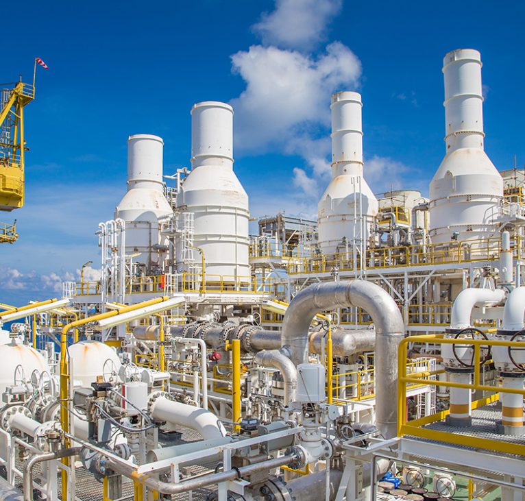 Pipe work and exhaust stack at offshore oil and gas central processing platform.