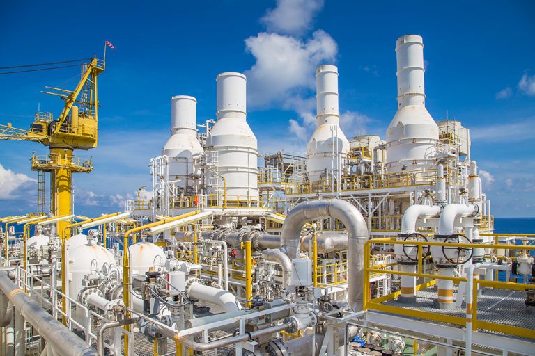 Pipe work and exhaust stack at offshore oil and gas central processing platform.